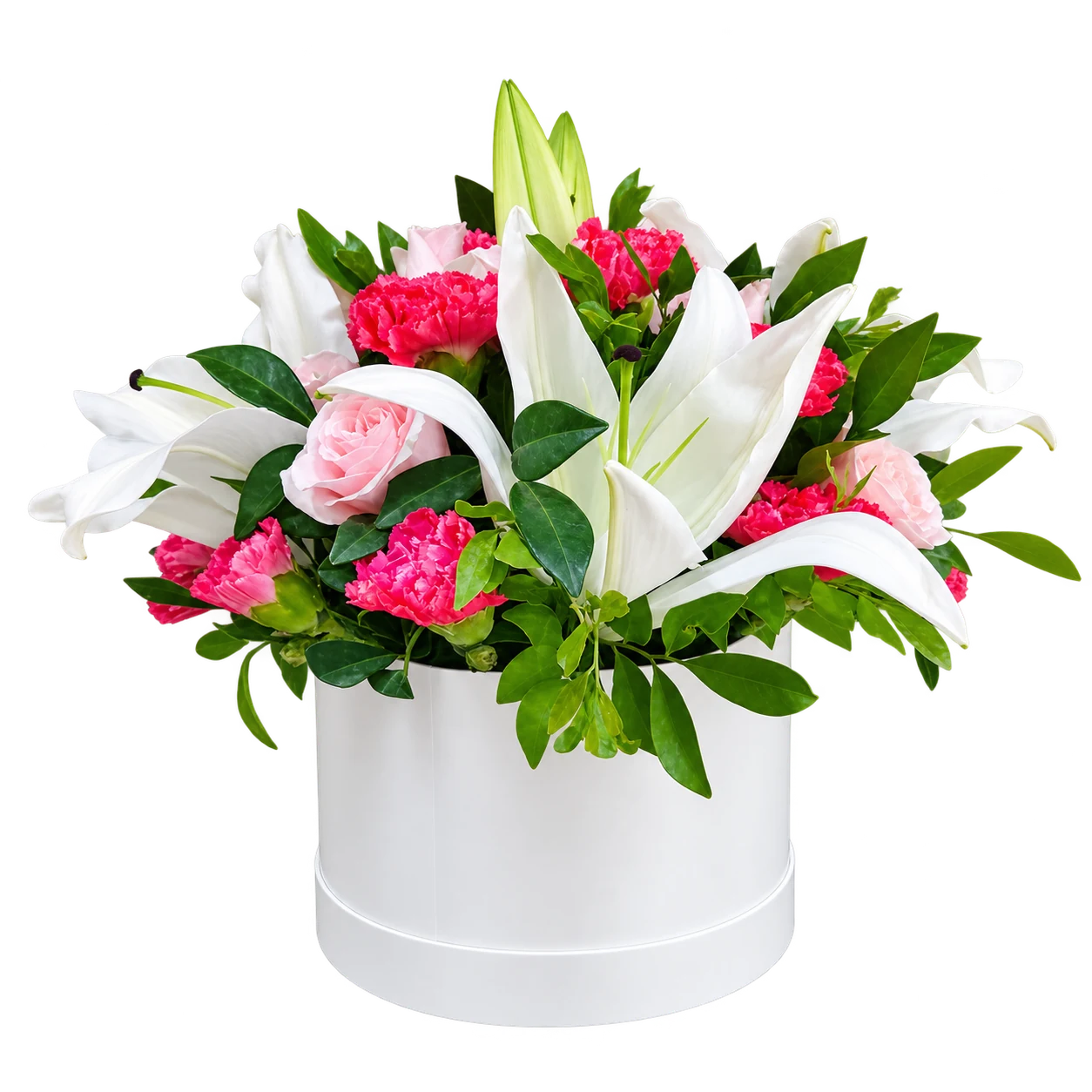 White lilies, red and pink roses and green foliage in a pale cylindrical container